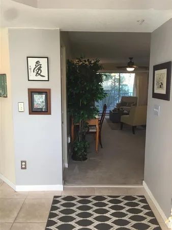 a view of livingroom with furniture window and front door