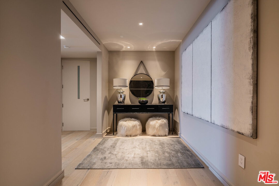 2391 Roscomare Road, Unit 103 Los Angeles, CA 90077 - Photo 2 of 32 a view of a hallway to a livingroom and front door