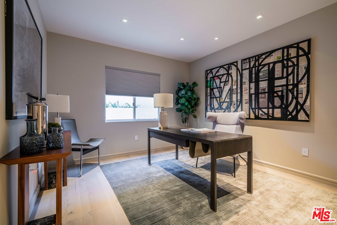 2391 Roscomare Road, Unit 103 Los Angeles, CA 90077 - Photo 14 of 32 a living room with furniture and a window