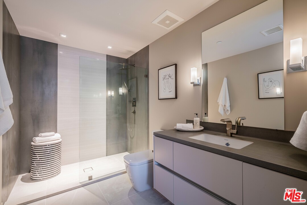 2391 Roscomare Road, Unit 103 Los Angeles, CA 90077 - Photo 16 of 32 a bathroom with a sink and a mirror