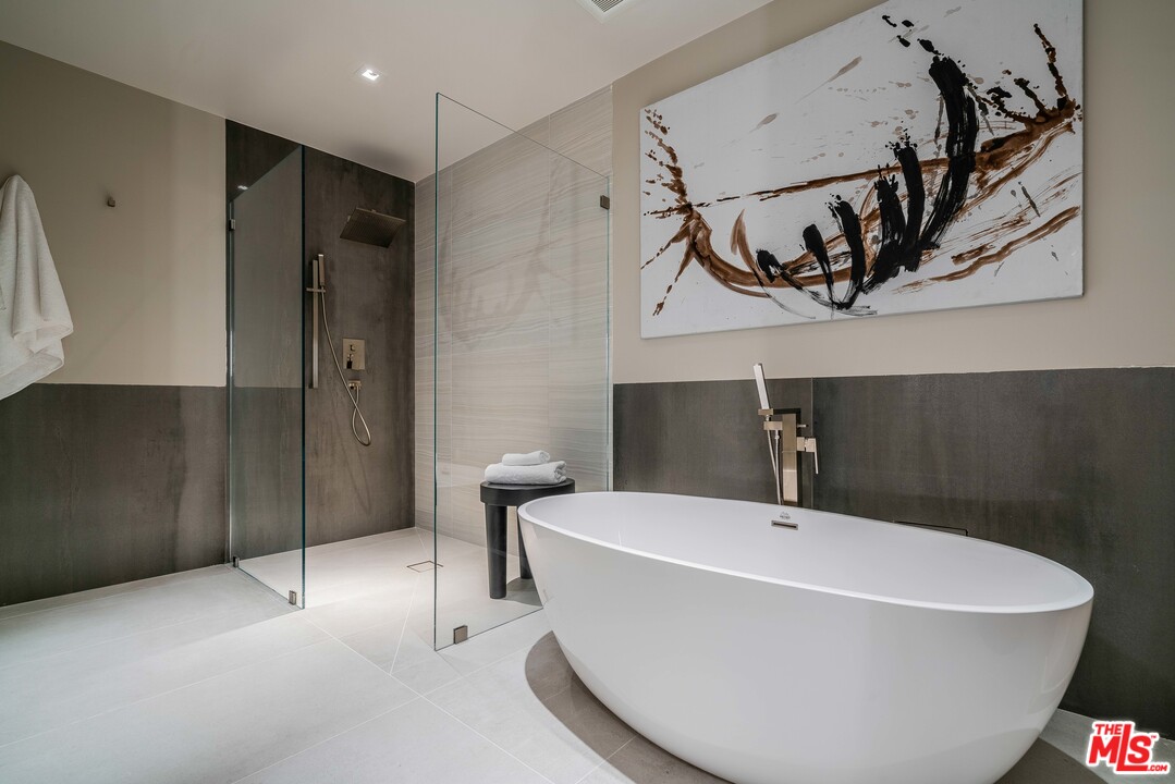 2391 Roscomare Road, Unit 103 Los Angeles, CA 90077 - Photo 18 of 32 a white bath tub sitting in a bathroom