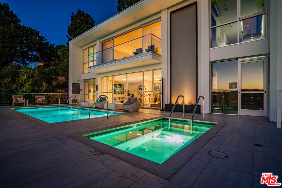 2391 Roscomare Road, Unit 103 Los Angeles, CA 90077 - Photo 29 of 32 a view of a patio with chairs and plants