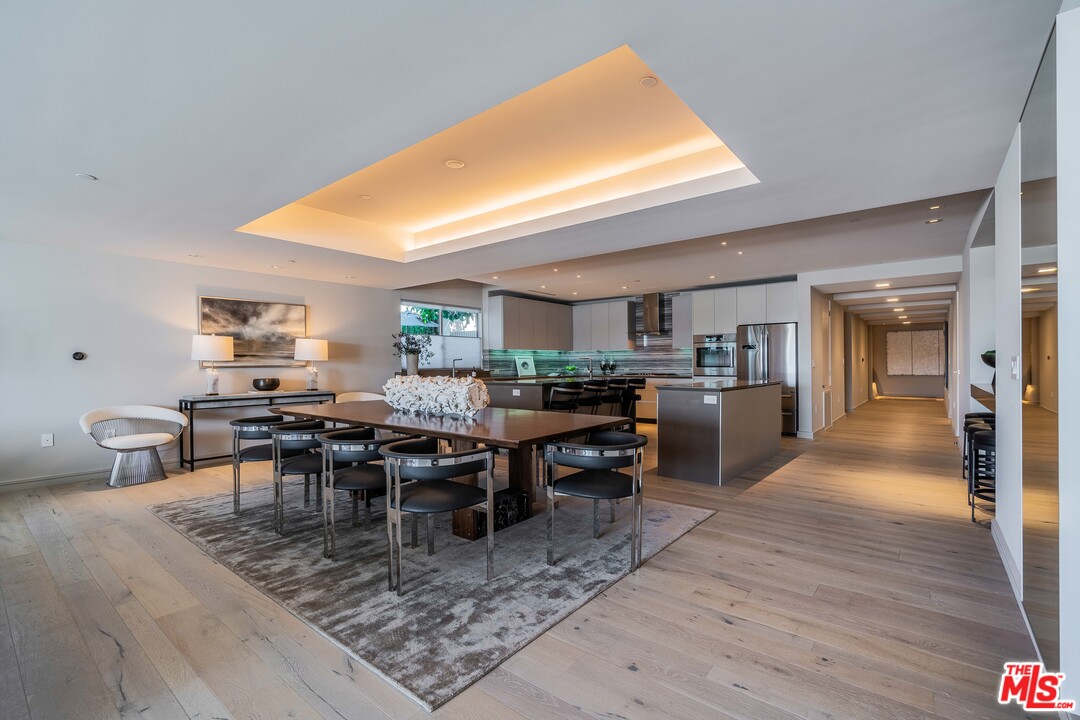 2391 Roscomare Road, Unit 103 Los Angeles, CA 90077 - Photo 7 of 32 a view of a dining room kitchen counter and furniture