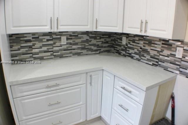 5975 Southwest 137th Avenue, Unit 803 Miami, FL 33183 - Photo 13 of 31 a close view of a sink a counter and cabinets