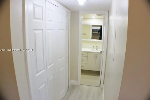 a close view of a sink and a toilet in front of a mirror