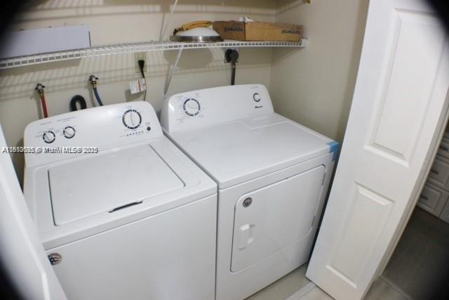 5975 Southwest 137th Avenue, Unit 803 Miami, FL 33183 - Photo 19 of 31 a utility room with dryer and washer