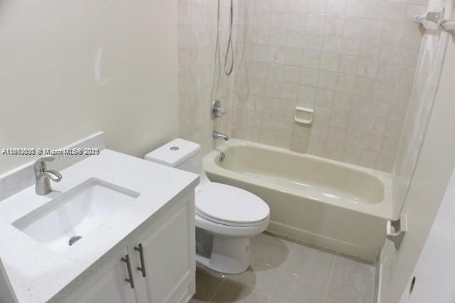5975 Southwest 137th Avenue, Unit 803 Miami, FL 33183 - Photo 21 of 31 a bathroom with a sink toilet and bathtub