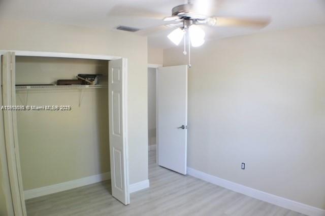 5975 Southwest 137th Avenue, Unit 803 Miami, FL 33183 - Photo 22 of 31 a view of empty room with wooden floor