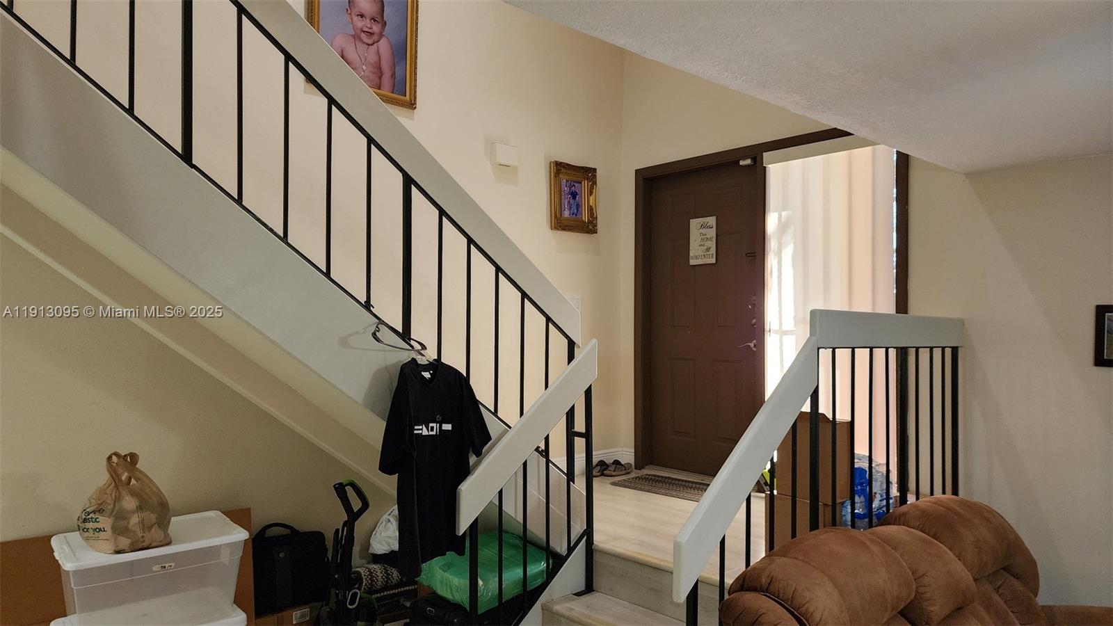 5975 Southwest 137th Avenue, Unit 803 Miami, FL 33183 - Photo 8 of 31 a view of entryway and hall with wooden floor