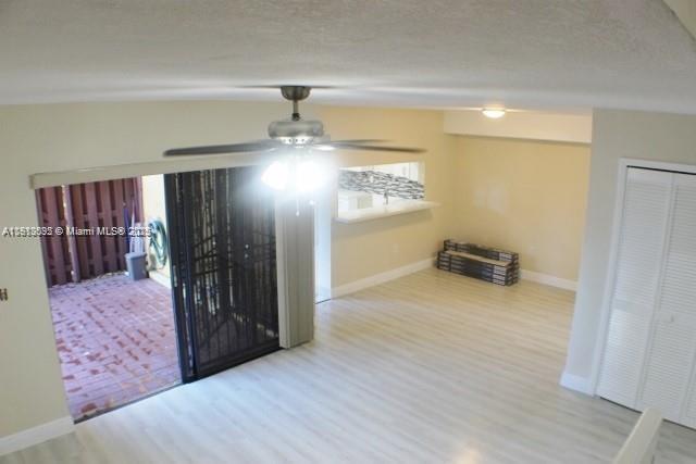 5975 Southwest 137th Avenue, Unit 803 Miami, FL 33183 - Photo 10 of 31 a view of entryway with stairs and wooden floor