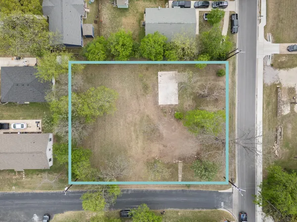 aerial view of a house with a yard