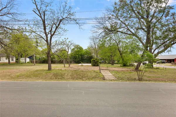 a view of yard with swimming pool