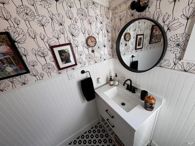 a view of a house with swimming pool and sitting area