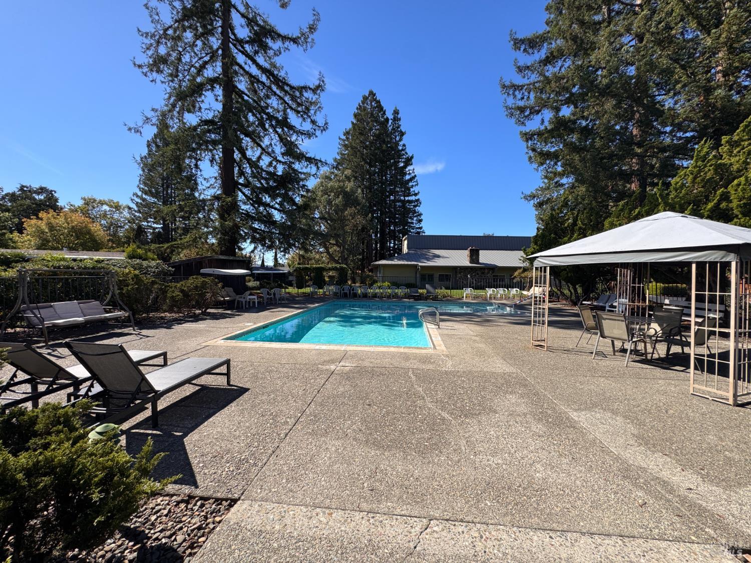 52 Oakstone Court, Unit 52 Santa Rosa, CA 95409 - Photo 44 of 49 an outdoor space with patio and white umbrellas