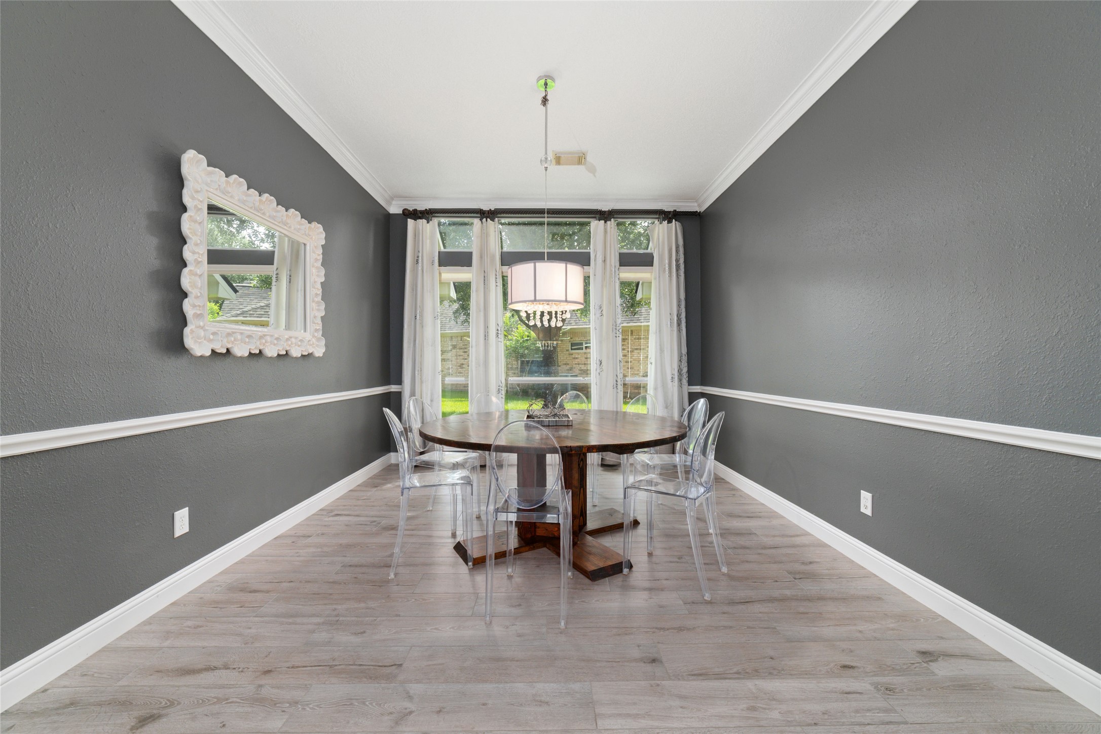24203 Moon Ridge Court Katy, TX 77494 - Photo 9 of 43 Bright spacious dining room features elegant modern design with crown molding and window dressings.