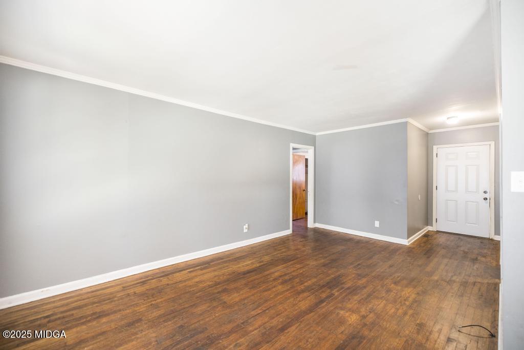1940 Manson Road Macon, GA 31217 - Photo 11 of 28 a view of an empty room with wooden floor