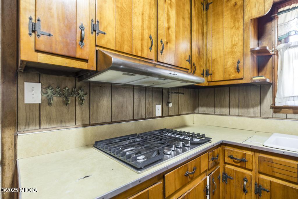 1940 Manson Road Macon, GA 31217 - Photo 16 of 28 a kitchen with stainless steel appliances granite countertop a stove and a sink