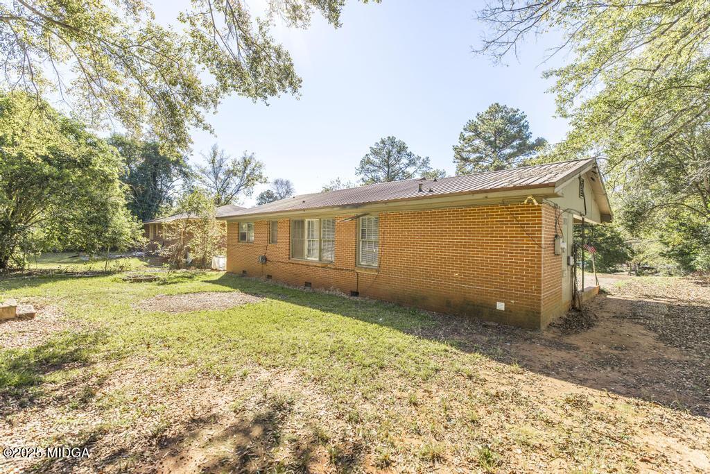 1940 Manson Road Macon, GA 31217 - Photo 26 of 28 a front view of a house with a yard