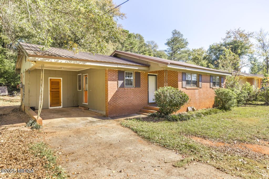 1940 Manson Road Macon, GA 31217 - Photo 4 of 28 a view of a house with yard and plants