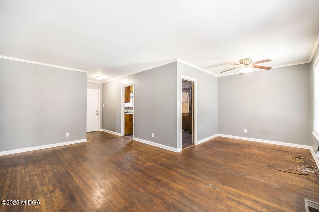 1940 Manson Road Macon, GA 31217 - Photo 10 of 28 a view of an empty room with wooden floor