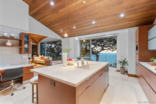 a view of counter top space with furniture and window