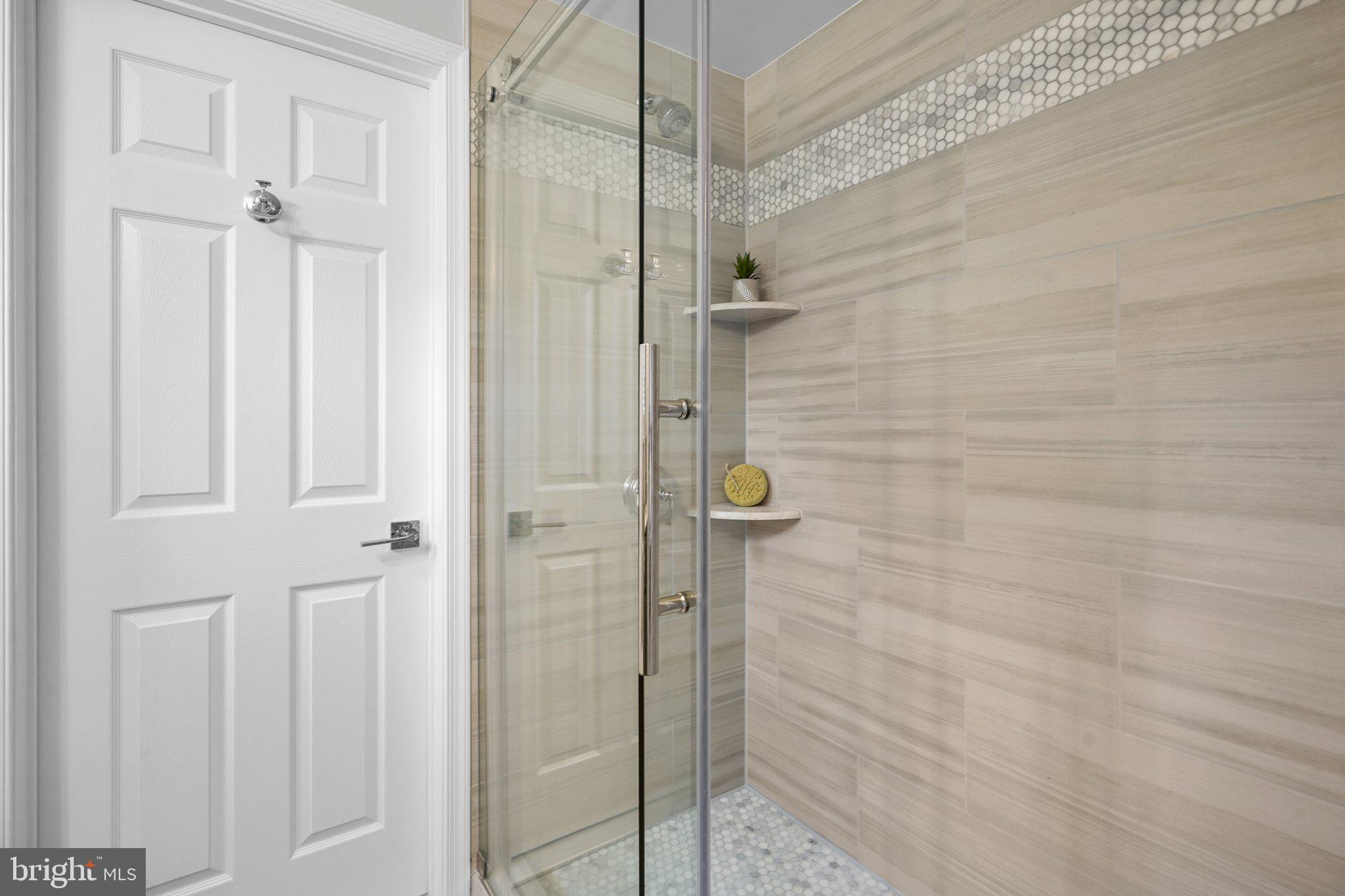 5005 Rodman Road Bethesda, MD 20816 - Photo 33 of 48 Walk-in shower w/upgraded tile and glass enclosure