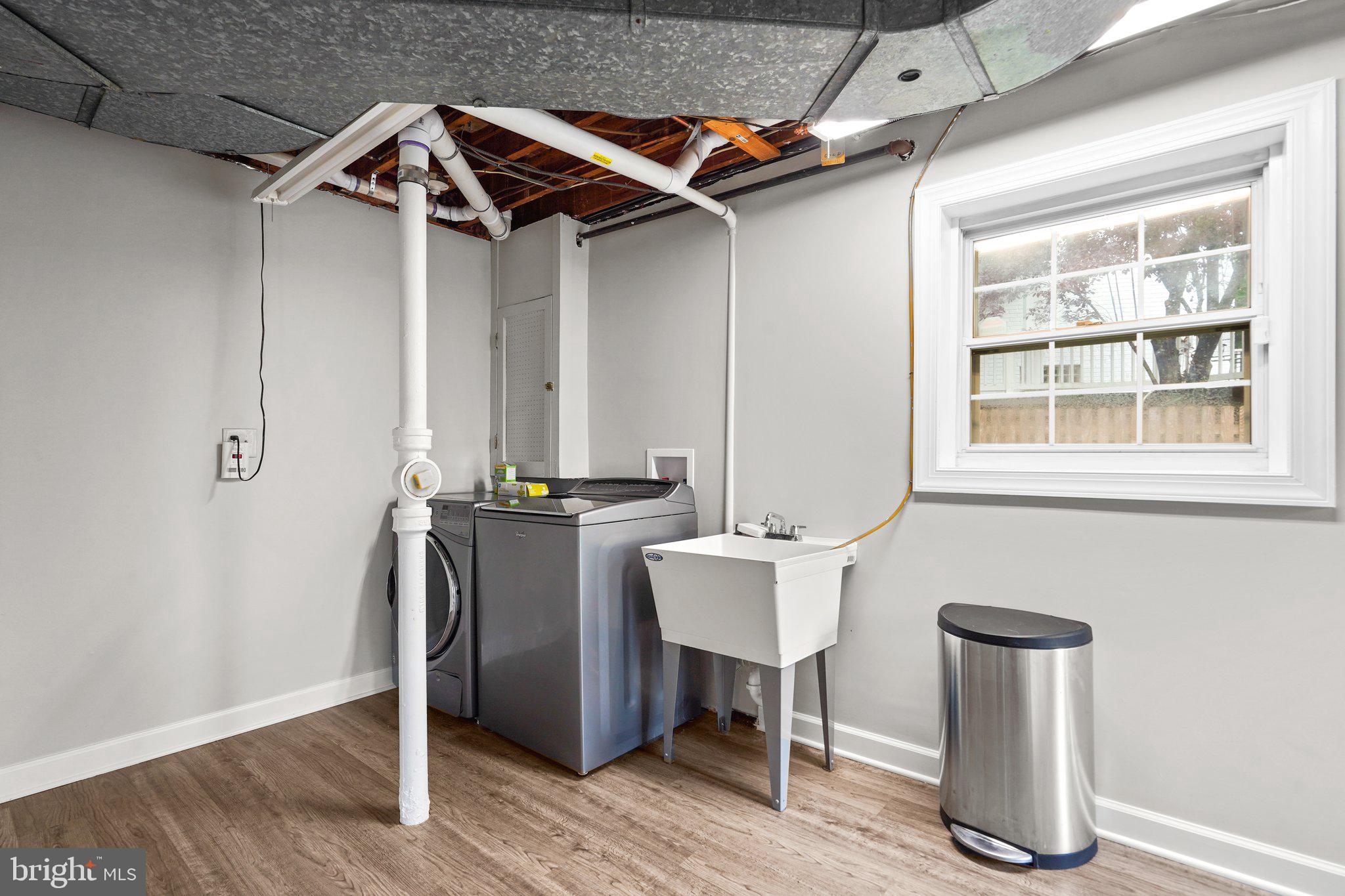 5005 Rodman Road Bethesda, MD 20816 - Photo 36 of 48 Laundry/Storage with utility sink and exit outdoor