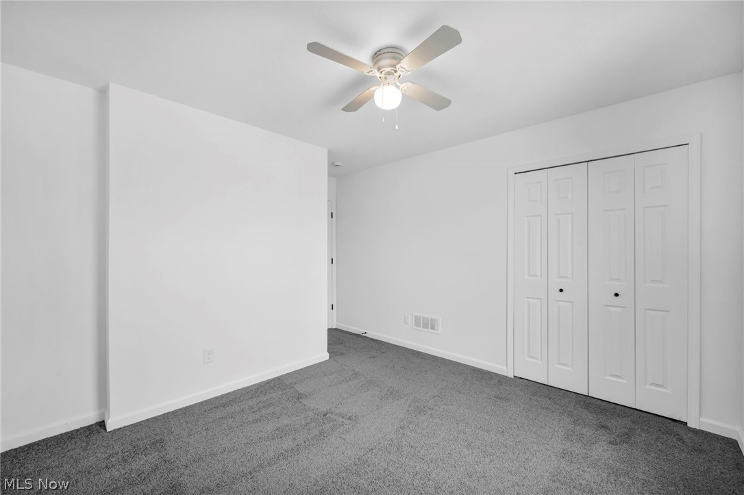 3670 Pennington Road Cleveland, OH 44120 - Photo 23 of 28 Unfurnished bedroom with carpet floors, ceiling fan, and a closet