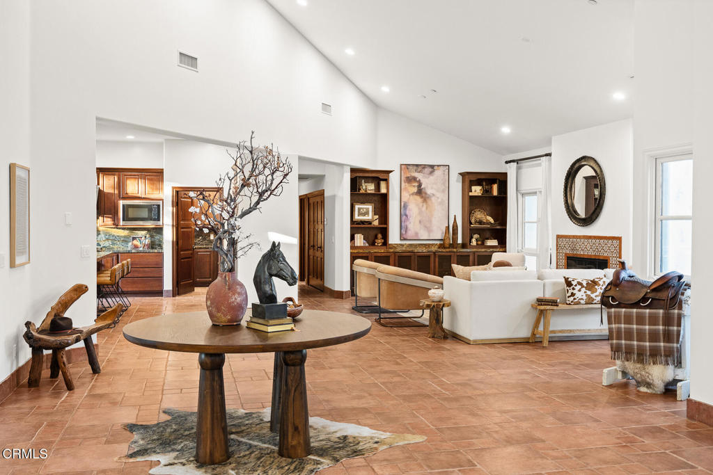 1533 Rancho Avenue Glendale, CA 91201 - Photo 2 of 8 a living room with fireplace furniture and a large window