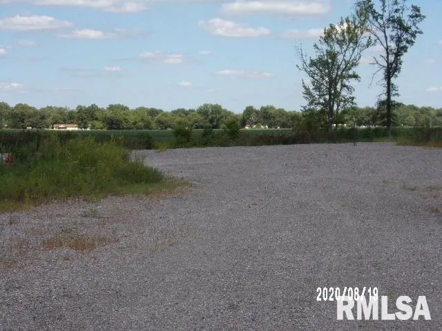 a view of lake with green space