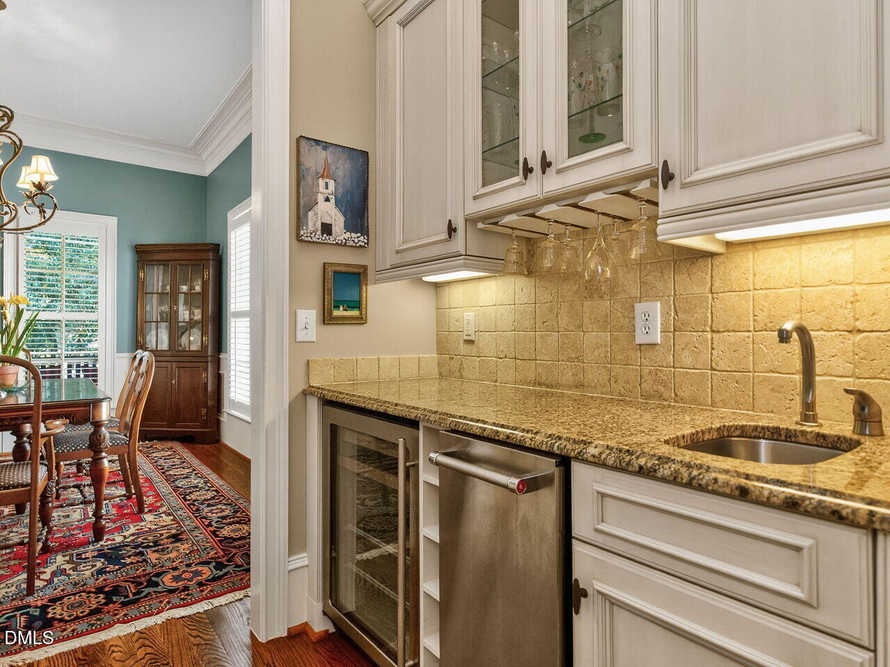 2644 Davis Street Raleigh, NC 27608 - Photo 6 of 30 a kitchen with stainless steel appliances granite countertop a sink and cabinets