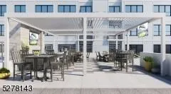 a view of a building with sitting area