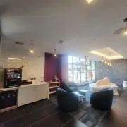 a kitchen with stainless steel appliances a lot of cabinets a sink and a counter top space