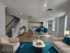 a living room with furniture and a table