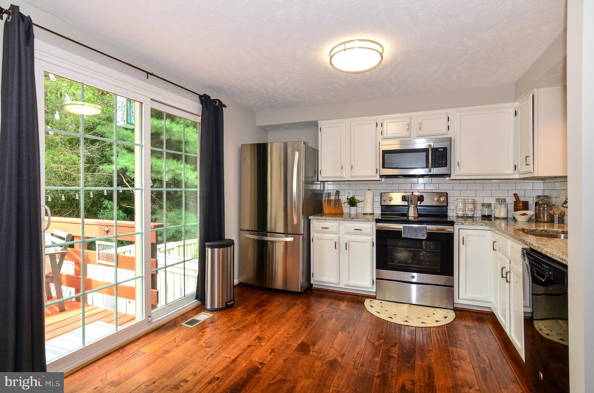 1604 Fieldthorn Drive Reston, VA 20194 - Photo 10 of 24 Large and bright updated kitchen walks out to deck