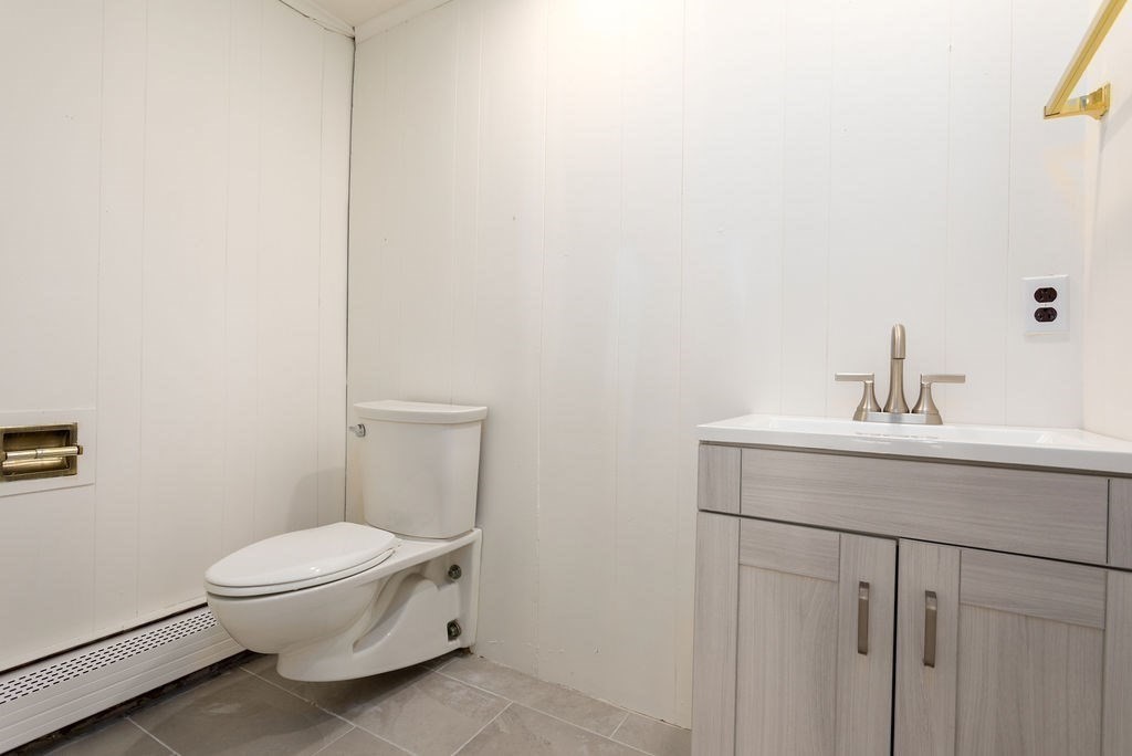 36 Intervale Road Worcester, MA 01602 - Photo 16 of 31 a bathroom with a sink a toilet and a mirror