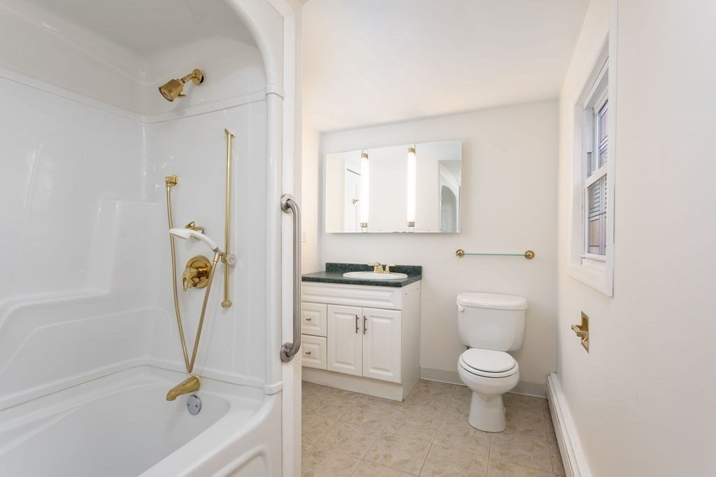 36 Intervale Road Worcester, MA 01602 - Photo 17 of 31 a bathroom with a granite countertop toilet a sink and a bathtub