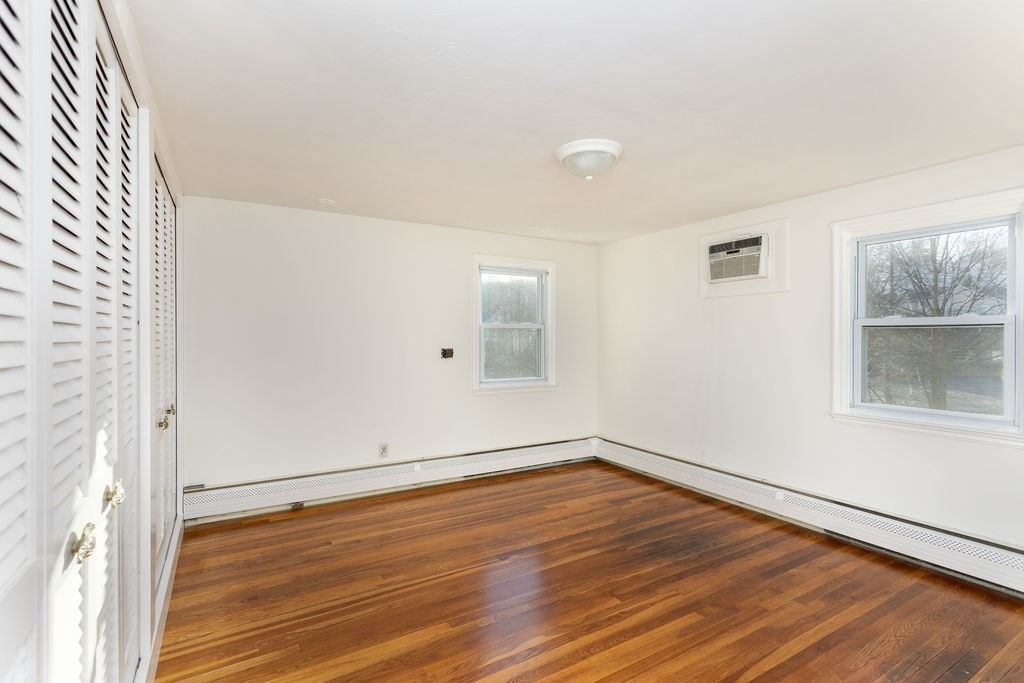 36 Intervale Road Worcester, MA 01602 - Photo 19 of 31 an empty room with wooden floor and windows