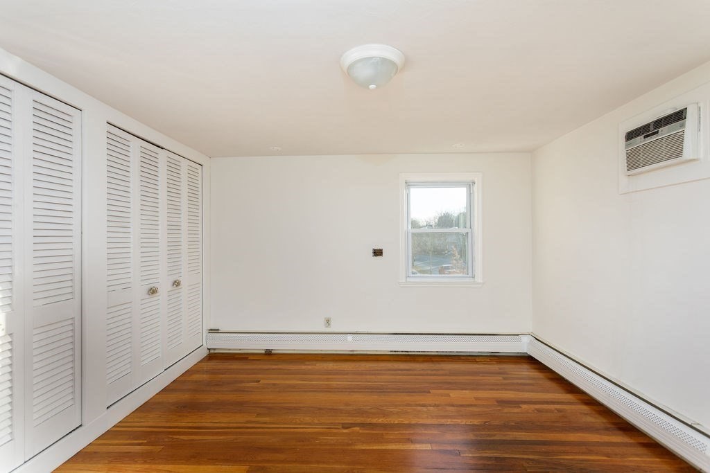 36 Intervale Road Worcester, MA 01602 - Photo 20 of 31 a view of an empty room with wooden floor and a window