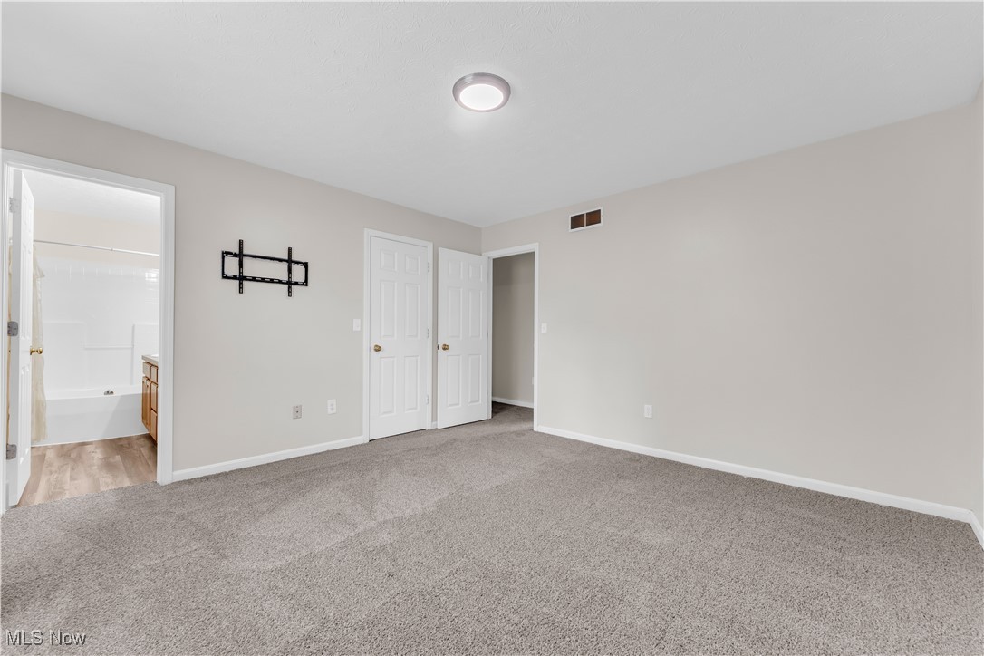 25861 Kennedy Ridge Road North Olmsted, OH 44070 - Photo 24 of 24 Unfurnished bedroom featuring carpet, baseboards, and connected bathroom