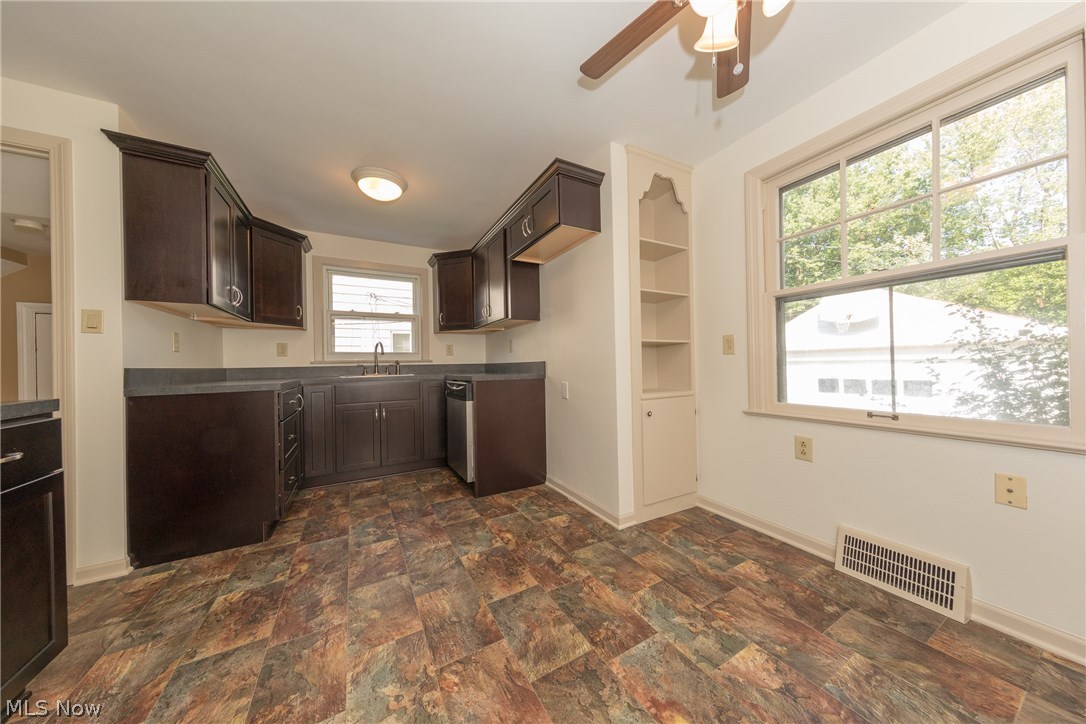 1235 Winston Road Cleveland, OH 44121 - Photo 3 of 30 This wonderfully remodeled Kitchen, complimented with new flooring, also has twin, built-in display cabinets to supplement all your storage needs