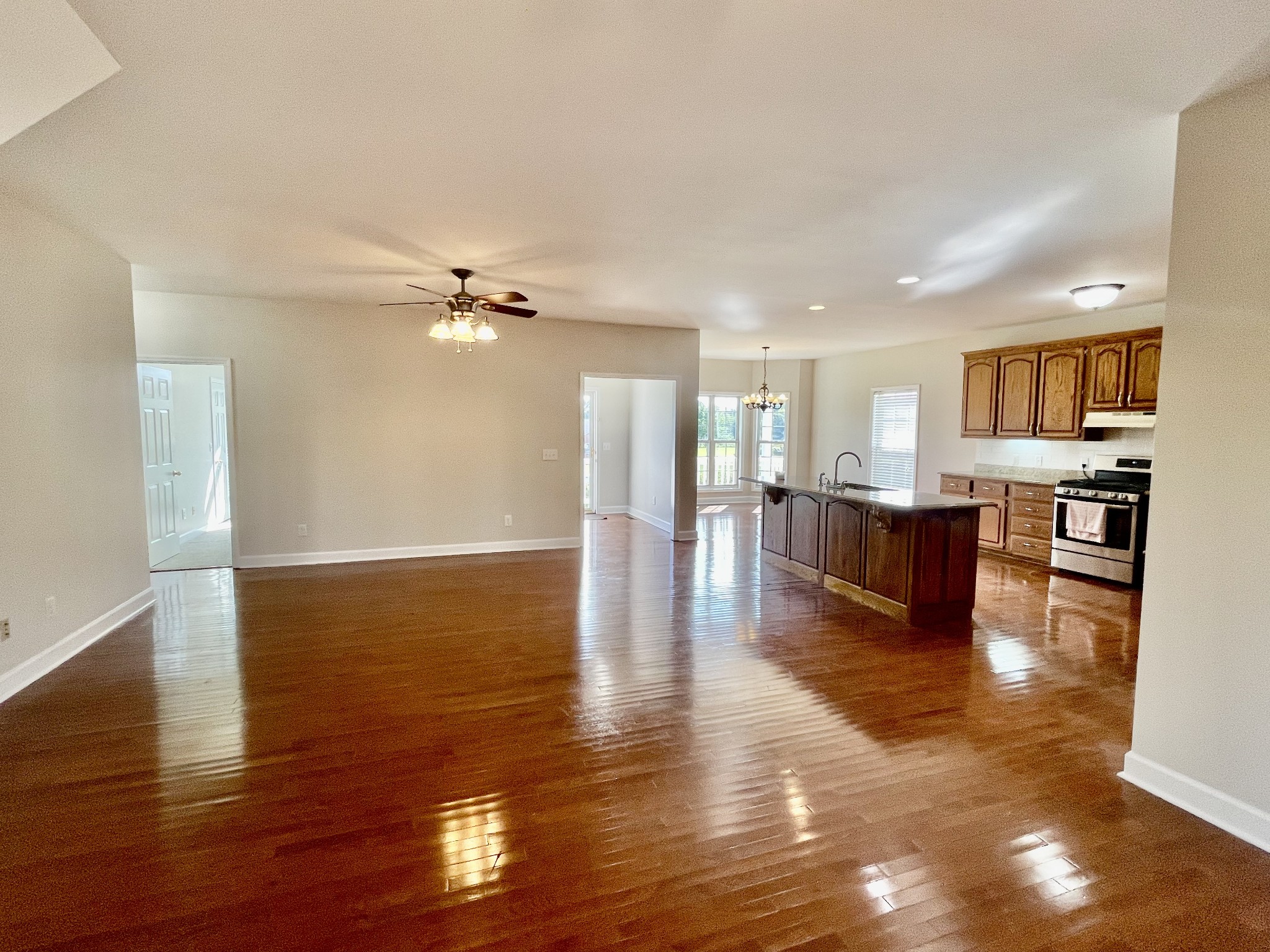 40 Harding Road Leoma, TN 38468 - Photo 11 of 35 a view of an empty room with wooden floor and a kitchen