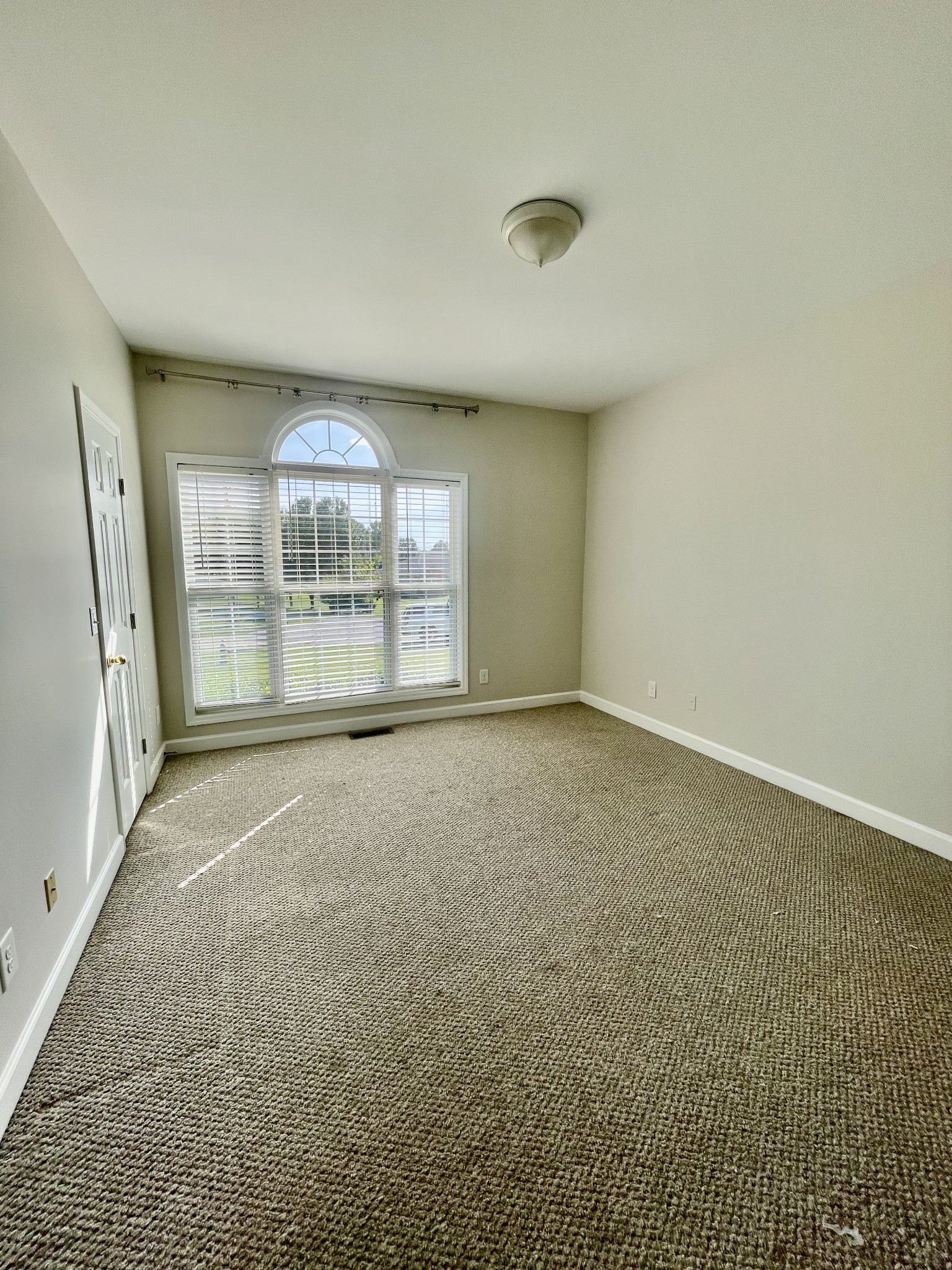 40 Harding Road Leoma, TN 38468 - Photo 16 of 35 an empty room with a fireplace and windows