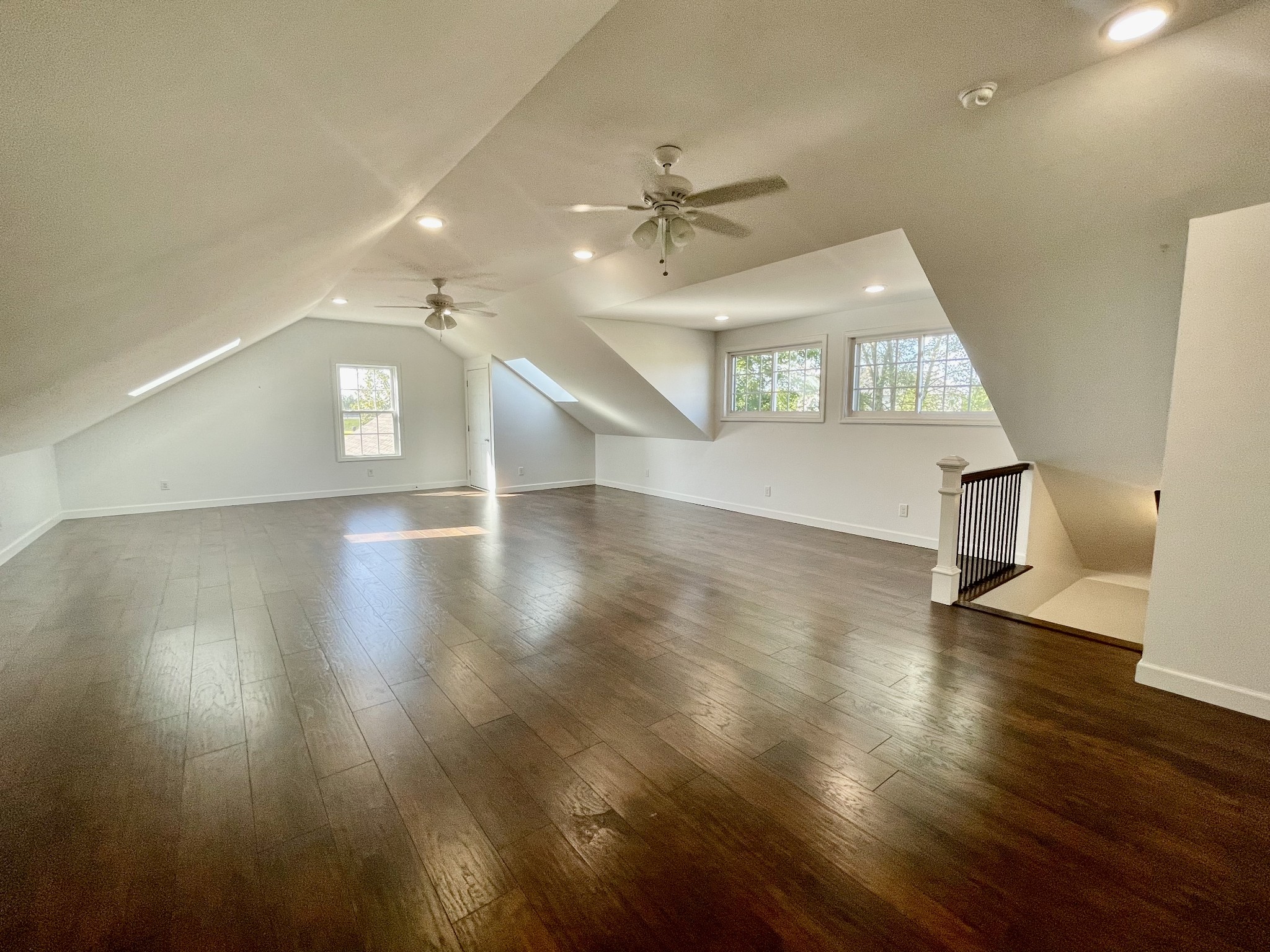 40 Harding Road Leoma, TN 38468 - Photo 23 of 35 an empty room with wooden floor ceiling fan and windows