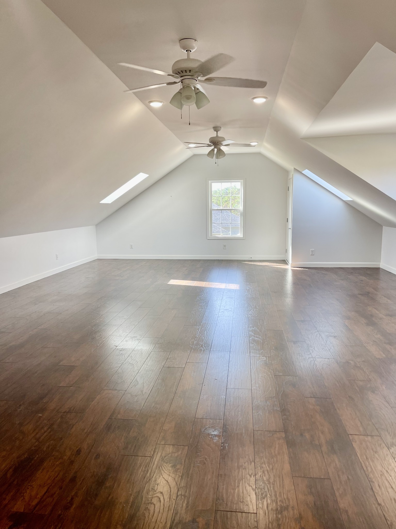 40 Harding Road Leoma, TN 38468 - Photo 24 of 35 an empty room with wooden floor chandelier fan and windows