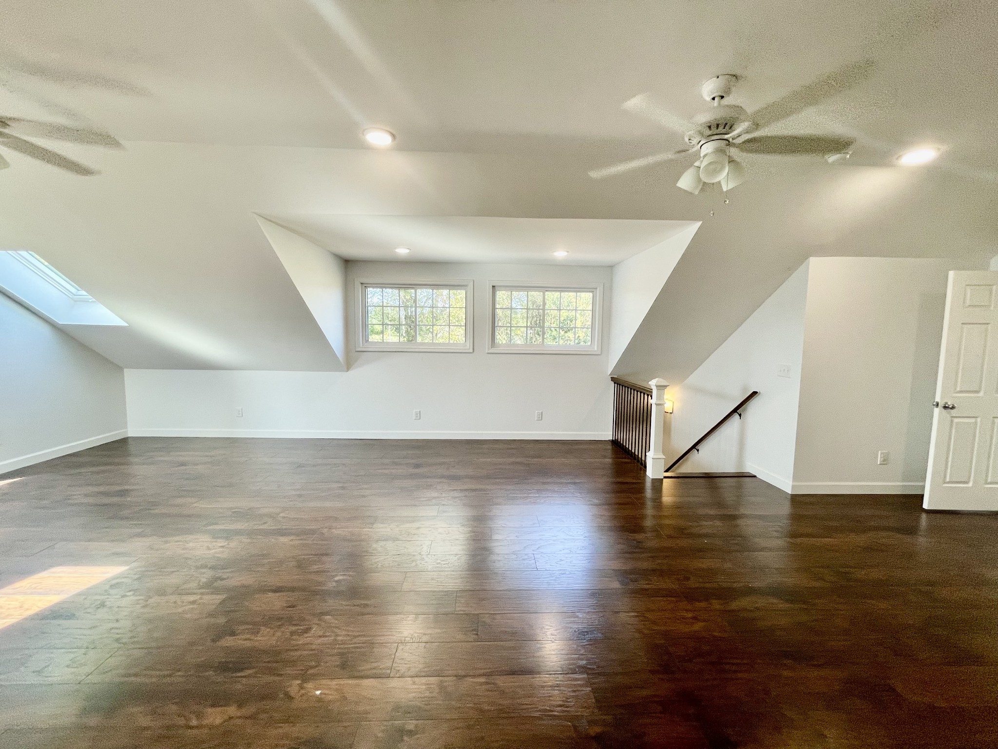 40 Harding Road Leoma, TN 38468 - Photo 26 of 35 a view of an empty room with wooden floor and a ceiling fan