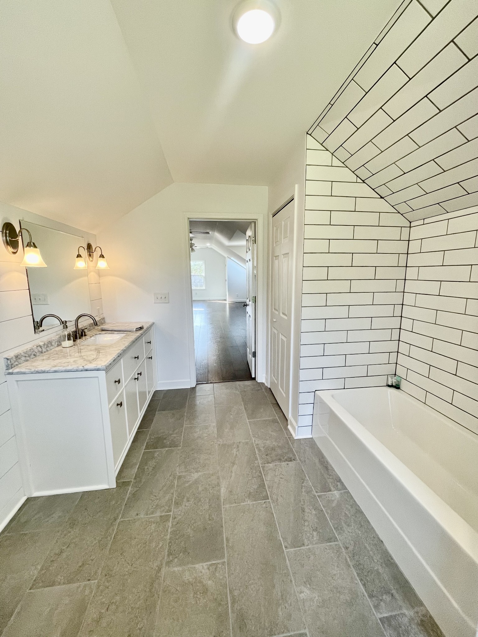 40 Harding Road Leoma, TN 38468 - Photo 30 of 35 a bathroom with a granite countertop sink a toilet and bathtub