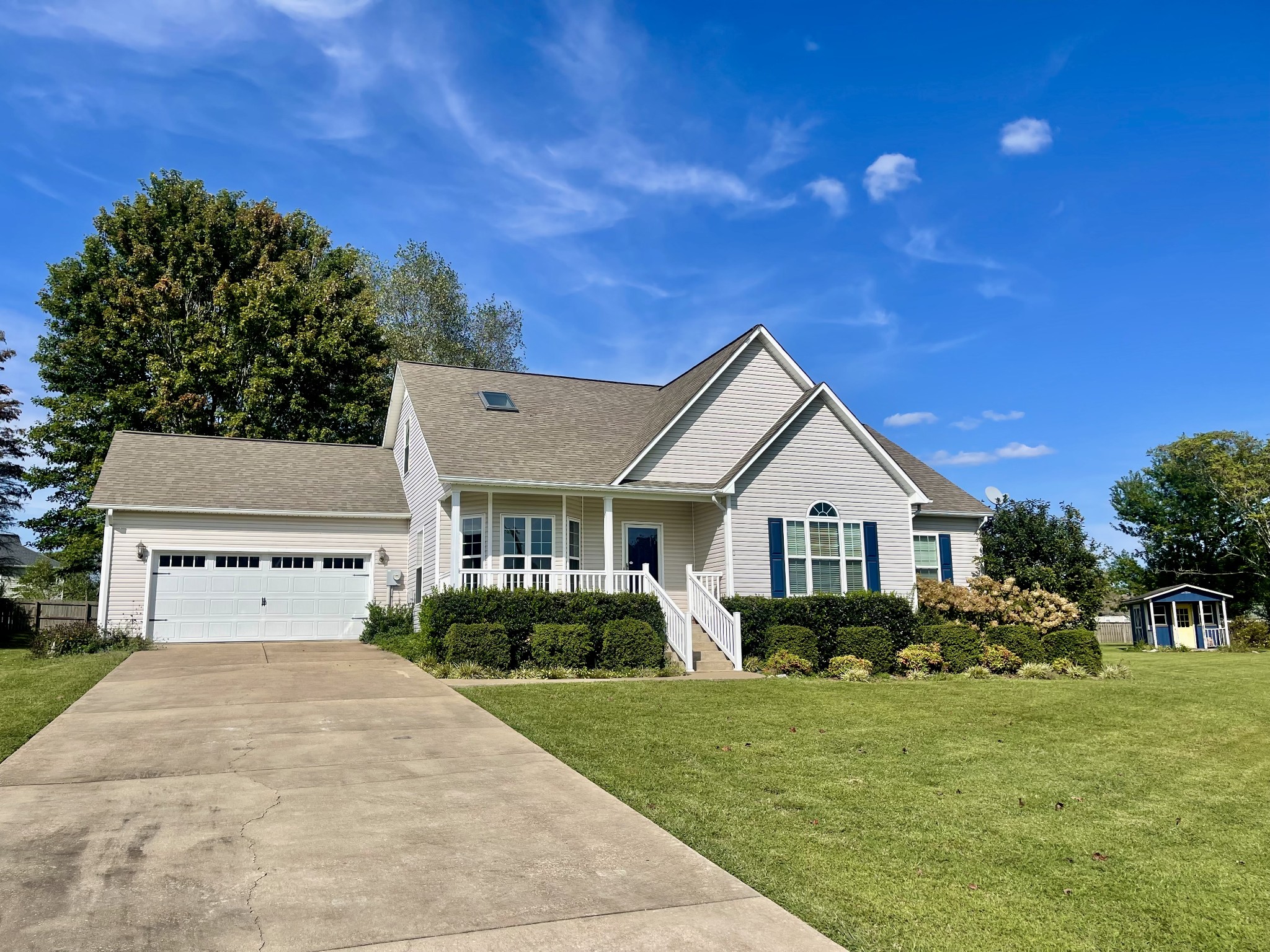 40 Harding Road Leoma, TN 38468 - Photo 3 of 35 a front view of a house with a yard and garage