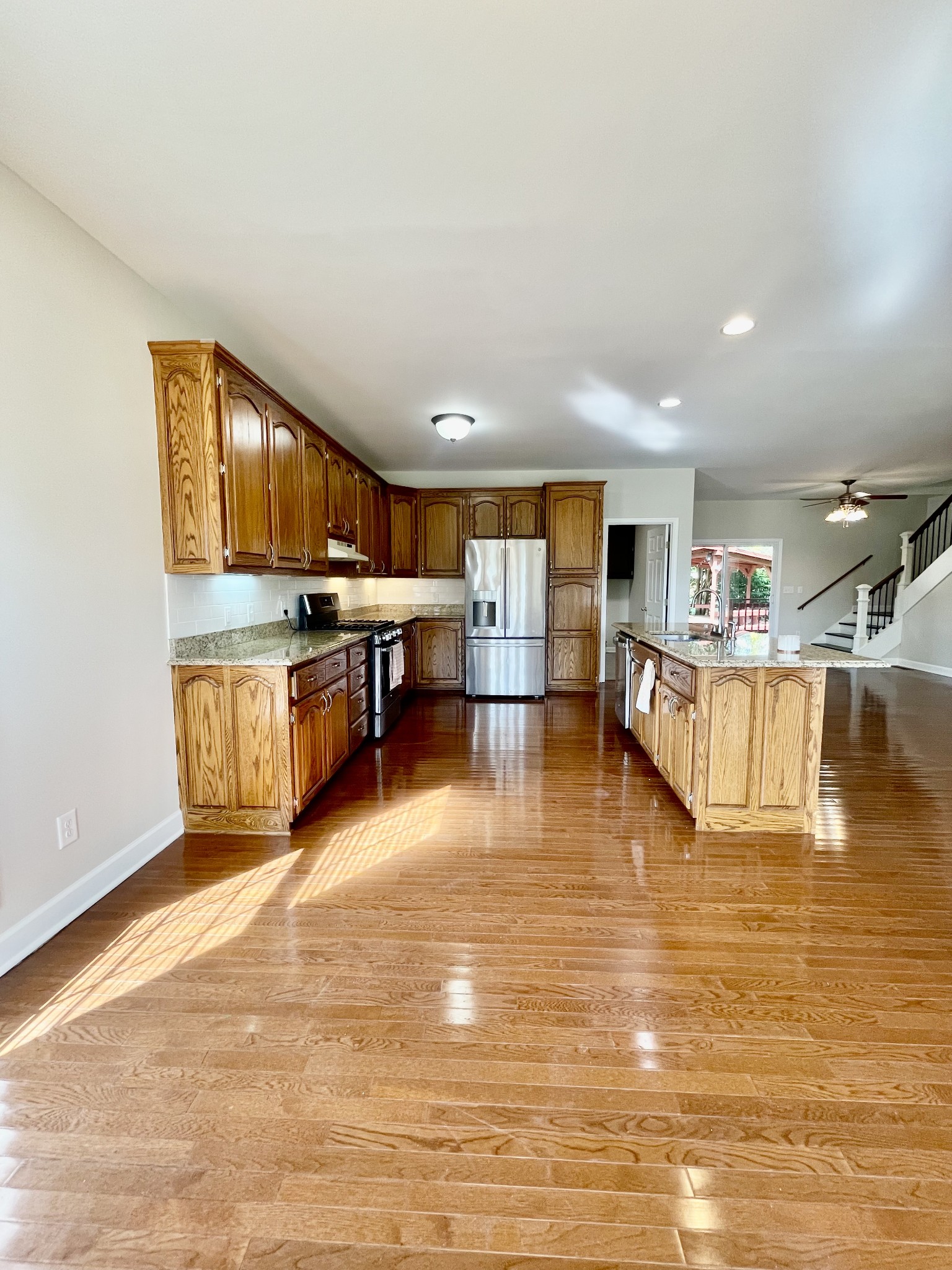40 Harding Road Leoma, TN 38468 - Photo 9 of 35 a room with wooden floors and kitchen view