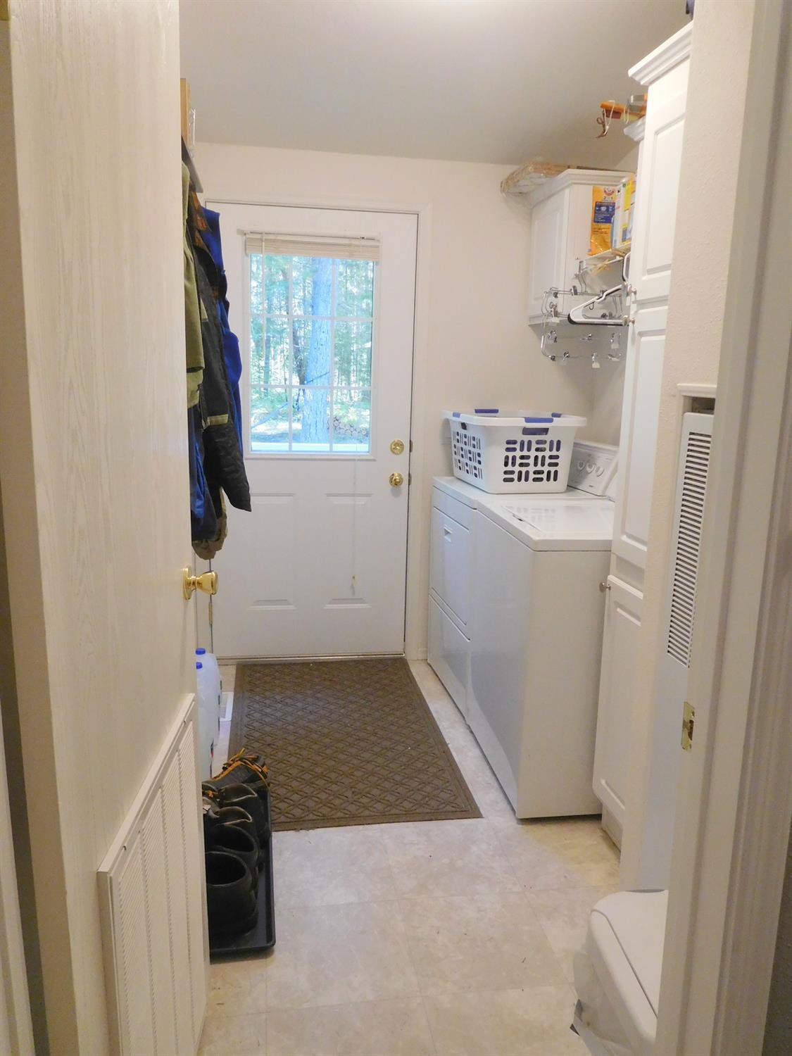 271 Kirkham Road Cave Junction, OR 97523 - Photo 18 of 33 Laundry room. extra linen storage, exit